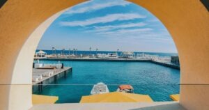 day trips from Hurghada showing calm Red Sea beach with turquoise water and soft sand